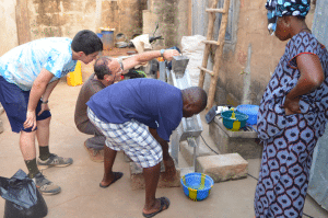 A new mechanical grinder processes baobob fruit in Benin