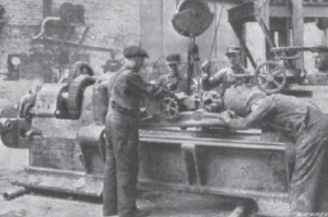 A crew builds a concrete lathe for shaping shells during World War I in this photo that appeared in Machinery magazine in June, 1916.