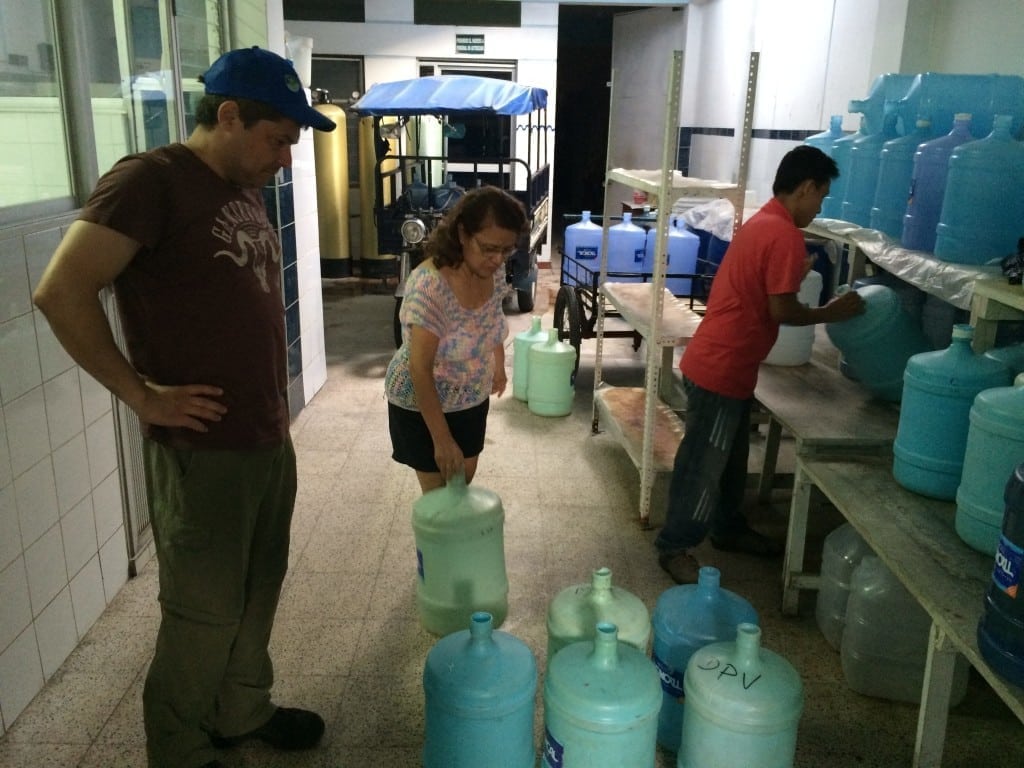 buying used & damaged water containers to make into male urinals