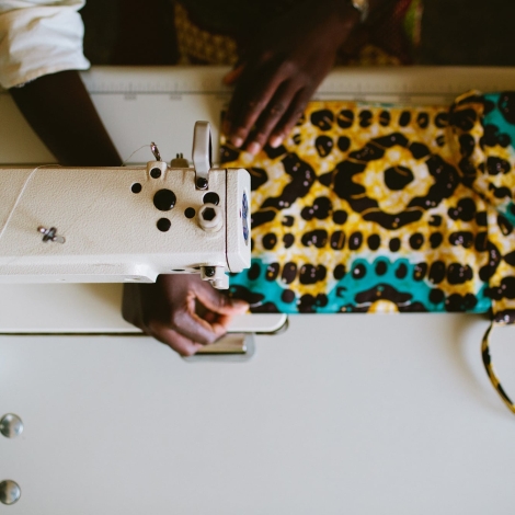 A Tala customer uses a sewing machine