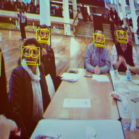 AI bias. Adam Harvey leads a demonstration on the functionality of facial recognition softwares and informs the audience of methods to help remain anonymous. This picture was taken during the second 