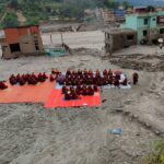 Buddhist monks conducting death rituals in Nepal’s Trishuli river valley in September 2026 to honour victims of devastating flash floods. Credit: Usha Titikshu, CC BY